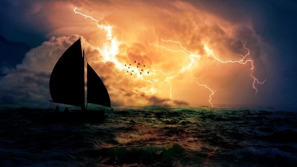 Sailboat storm on horizon open ocean