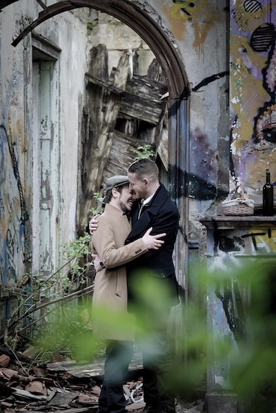 adults hugging abandoned art building